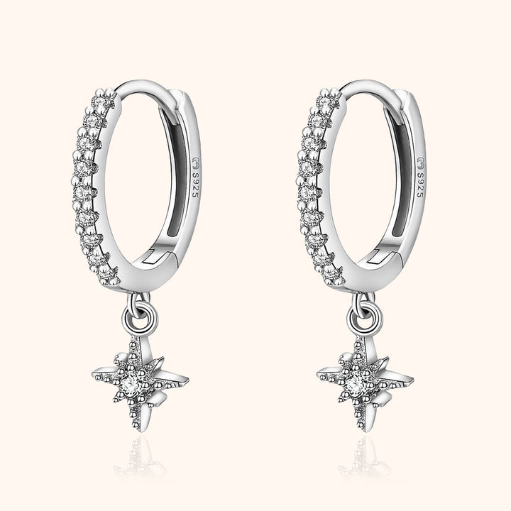 Women's celestial star hoop earrings, elegant gold plated fashion jewelry with sparkling zirconia accents.