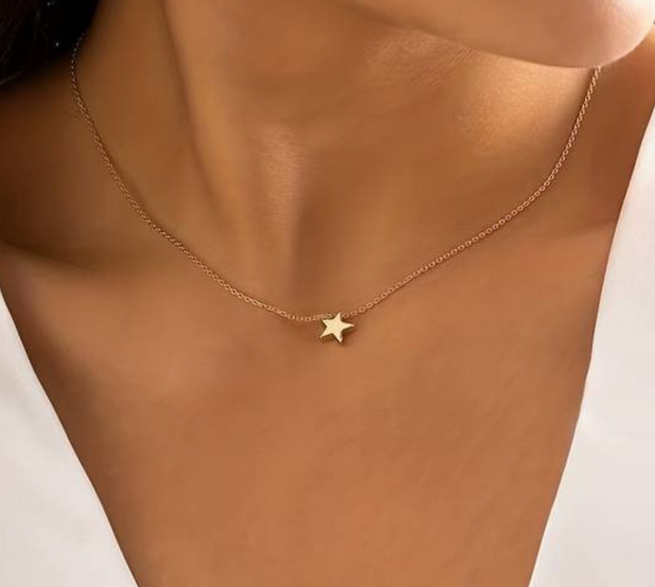 Elegant celestial star necklace, a women's luck charm in shimmering gold or silver, perfect for daily wear.