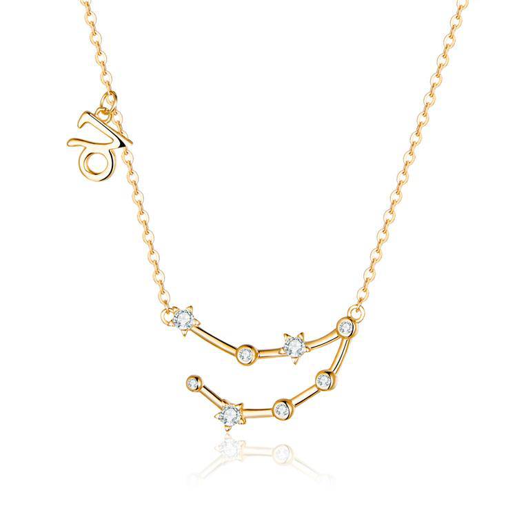 Fine detail of a gold plated zodiac constellation on a women's celestial necklace.