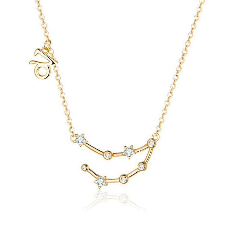 Fine detail of a gold plated zodiac constellation on a women's celestial necklace.