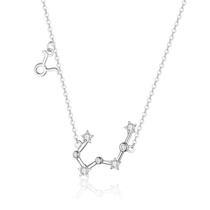 Two women's zodiac necklaces, one sterling silver, one gold plated, celestial design.
