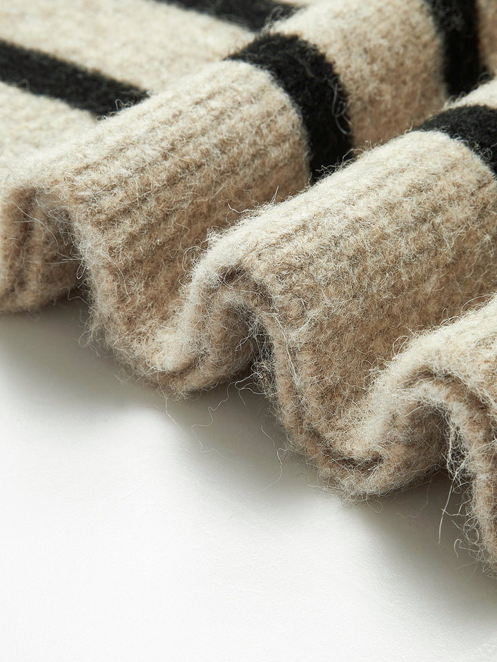 Stylish women's oversized striped knit sweater, perfect for casual autumn and winter fashion.