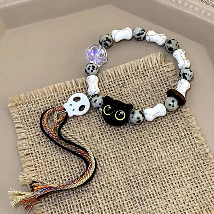 Women's ceramic Kittens & Skull charm bracelet. Handmade, unique bohemian jewelry with fringe details.