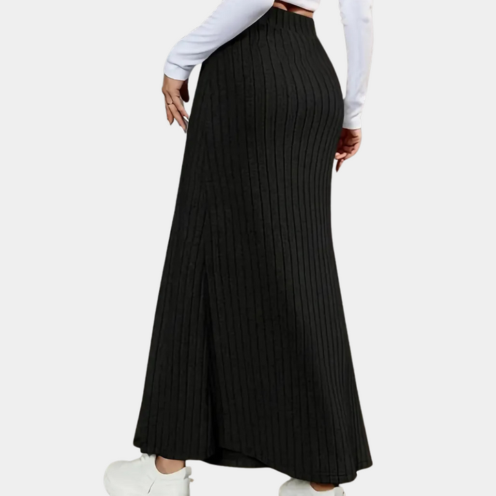 Close-up of the ribbed knit fabric on a women's long maxi skirt, showing texture and quality