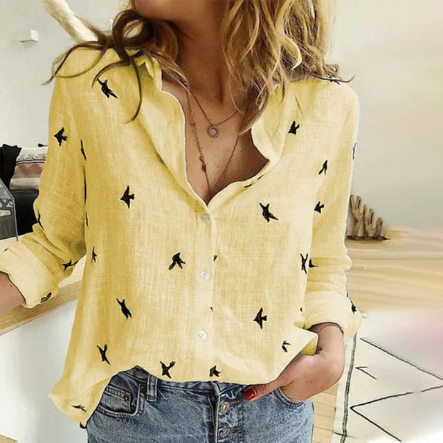 Stylish women's bird print button-up blouse. Long sleeve, collared casual top, ideal for comfortable spring fashion.
