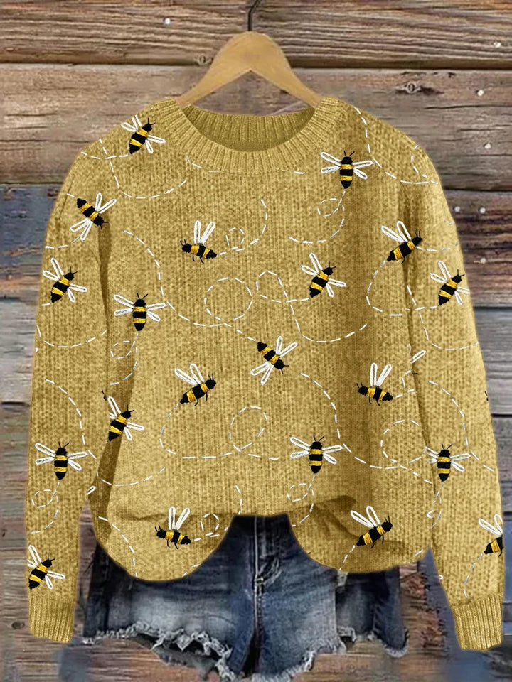 Women's charming Marlise knitted sweater with detailed embroidered bee motif, ideal for cozy winter fashion.