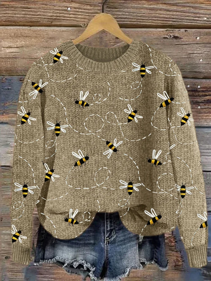 Cozy women's winter sweater with a charming embroidered bee, perfect for stylish and warm casual wear.