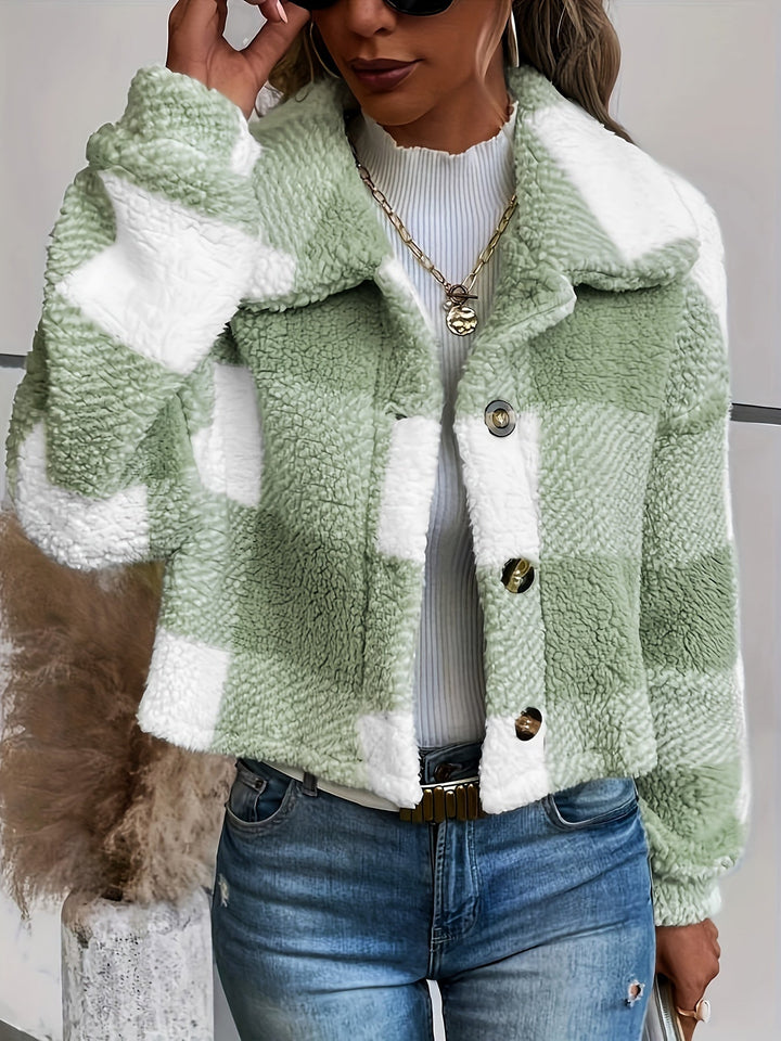 Comfortable women's winter jacket featuring a checked pattern and button closure. Cozy & warm outerwear.