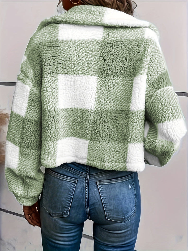 Elegant women's checked teddy coat with a classic button closure. Ideal for chic fall/winter style.