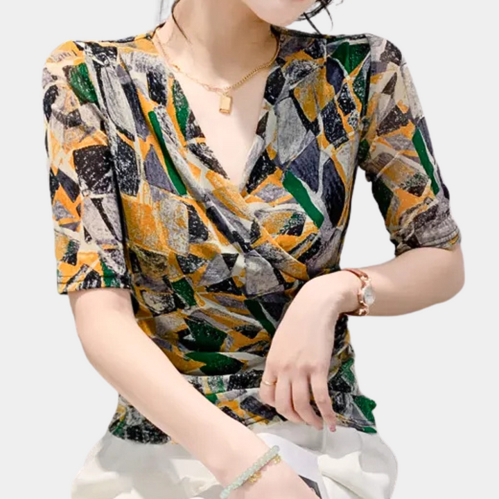 Women's cheerful V-neck blouse with vibrant abstract geometric pattern, perfect for casual chic or elegant business attire.