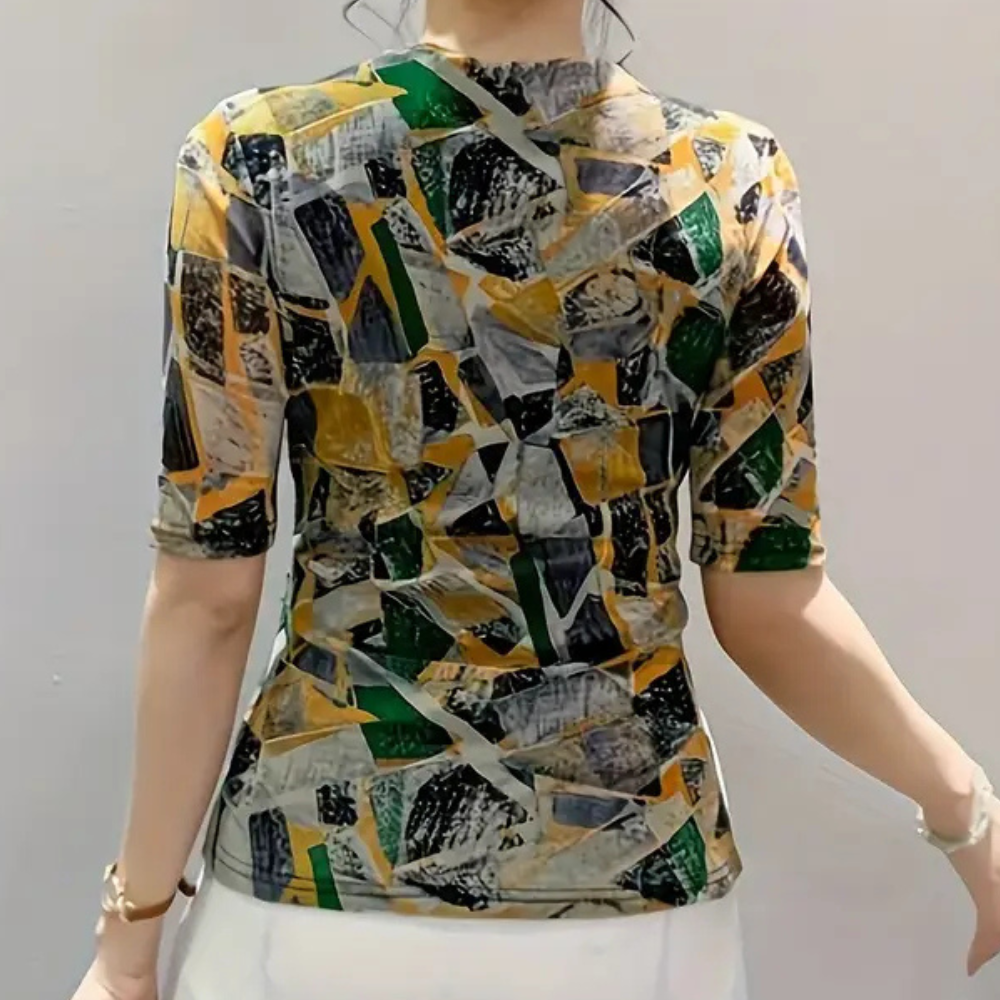Cheerful women's V-neck blouse featuring a modern abstract print. Versatile fashion for business, casual, or elegant wear.