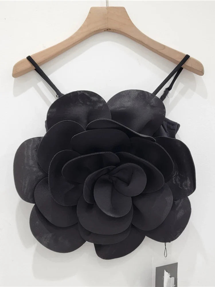 Elegant women's flower top featuring intricate 3D floral embellishments, a unique design.
