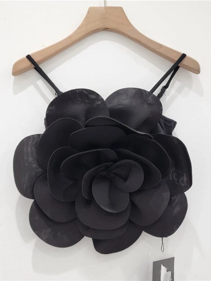 Elegant women's flower top featuring intricate 3D floral embellishments, a unique design.