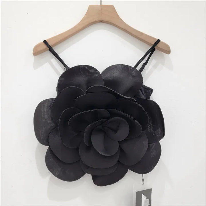 Fashionable women's floral top with eye-catching 3D flower details, an elegant blouse.
