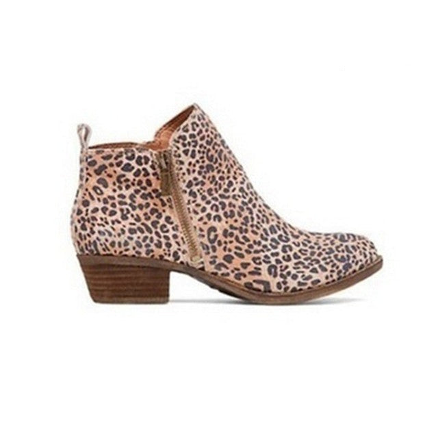 Comfortable women's ankle boots featuring a stable block heel and practical side zip. Chic footwear for any casual occasion.