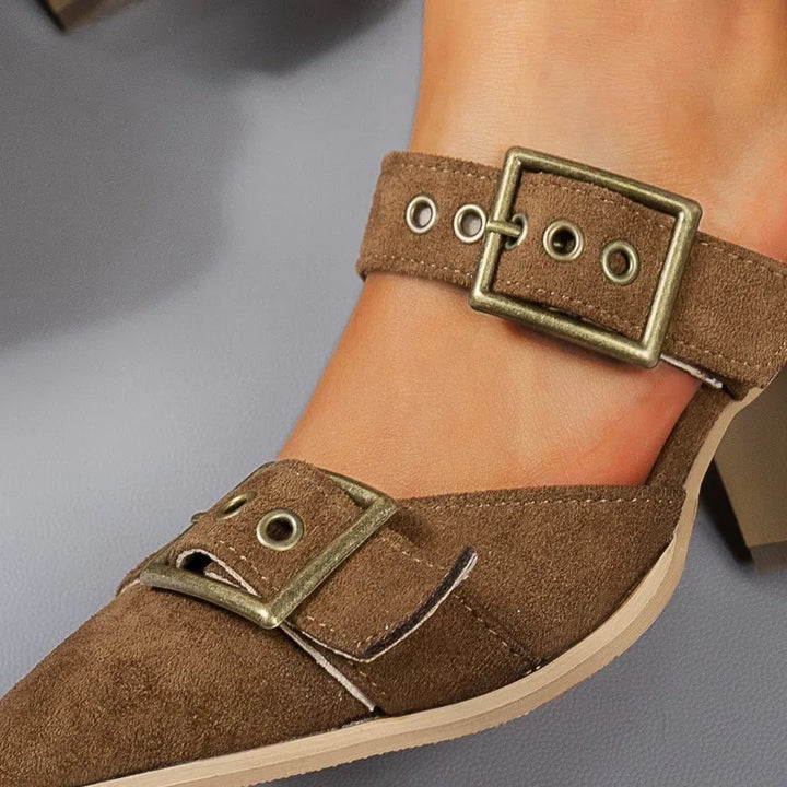 Chic women's black block heels with a prominent buckle, offering a blend of style and stability.