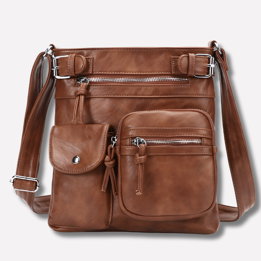 Women's chic black crossbody bag with multiple zippered pockets & adjustable strap for everyday organization.