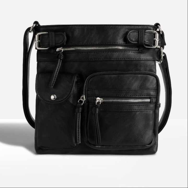 Comfortable women's everyday crossbody bag featuring multiple pockets for easy organization & an adjustable shoulder strap.