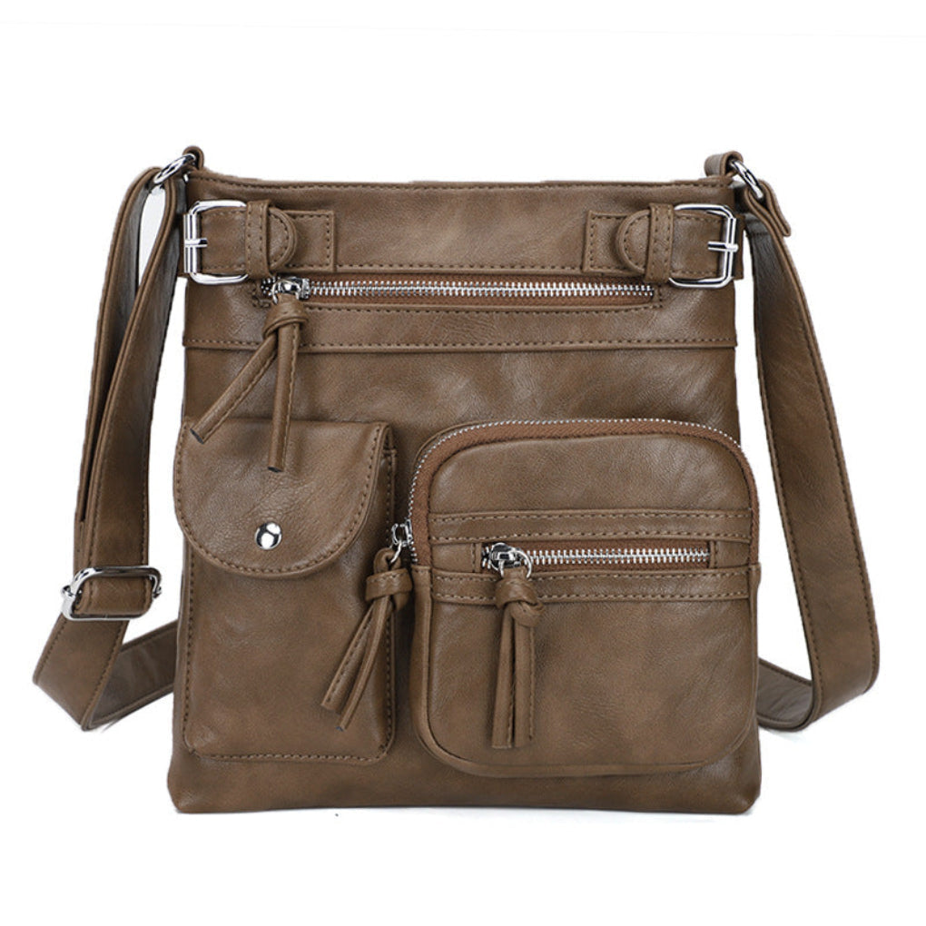 Modern women's multi-pocket messenger bag, spacious interior, adjustable strap for convenient carrying of daily essentials.