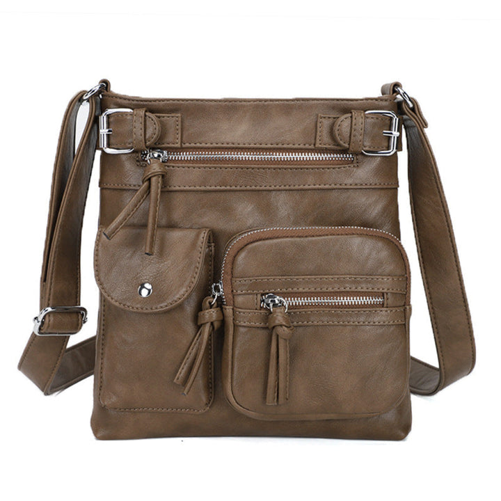 Modern women's multi-pocket messenger bag, spacious interior, adjustable strap for convenient carrying of daily essentials.