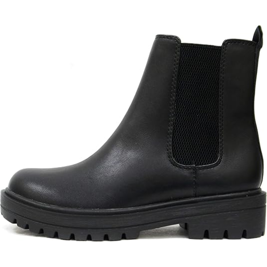 Detail shot of the durable sole on women's chic low heel Chelsea ankle boots.