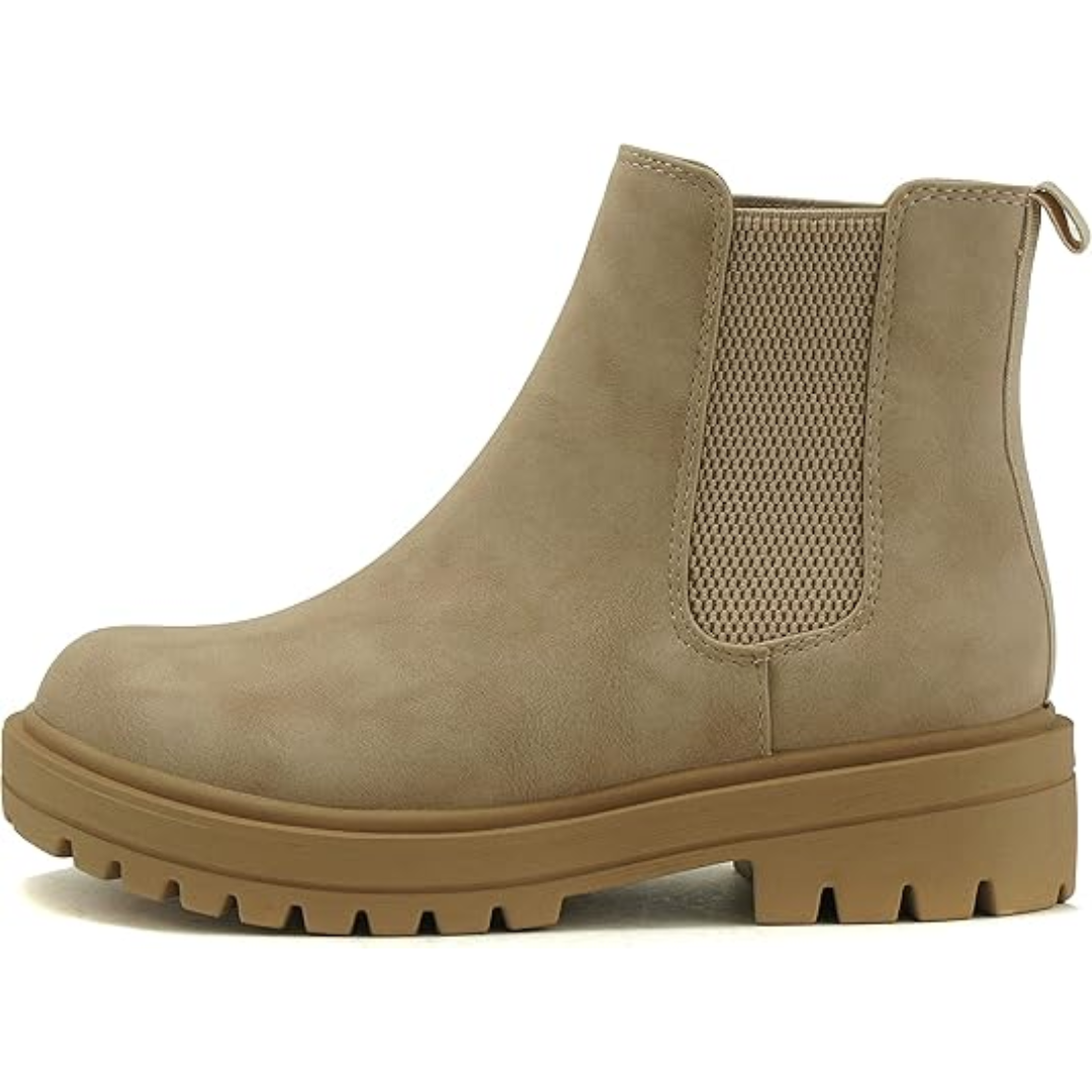 Side view of women's comfortable black Chelsea ankle boots with a modest low heel.
