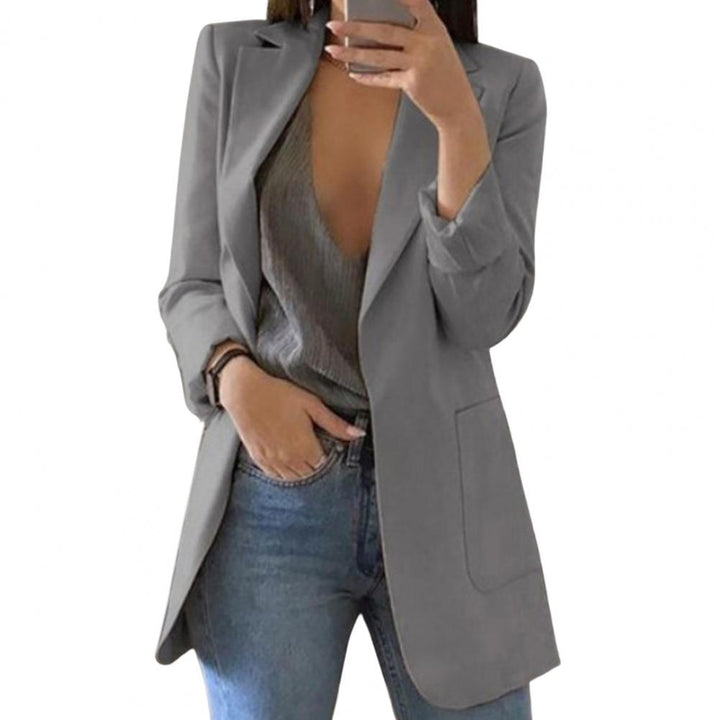 Versatile women's blazer with pockets. Perfect for chic professional workwear or stylish casual outfits.