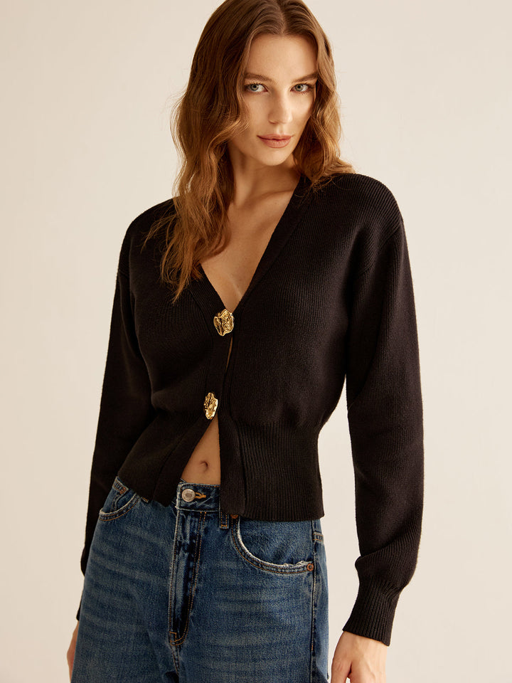 Chic black button sweater for women. This elegant knit long-sleeve top is perfect for versatile fall and winter fashion.