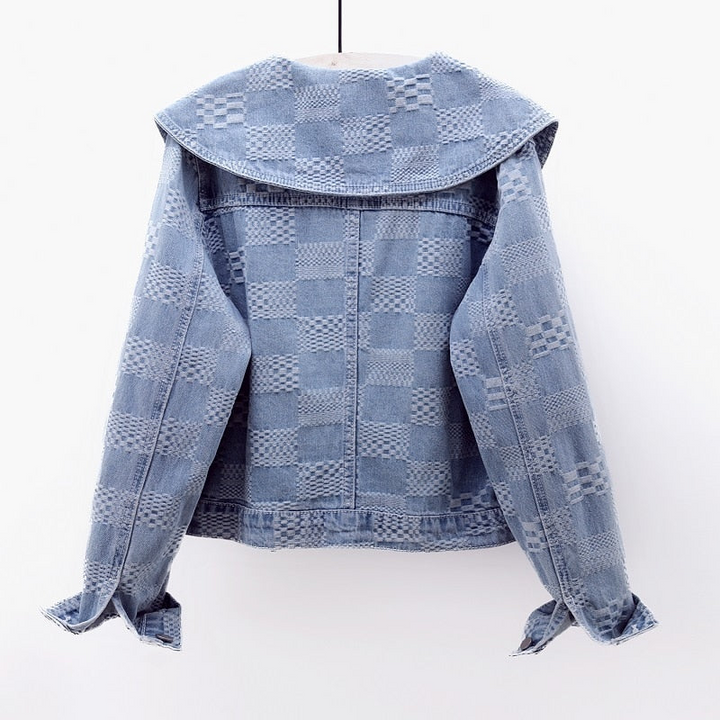 Blue cropped denim jacket for women, showcasing an oversized collar. A versatile and chic outerwear piece.