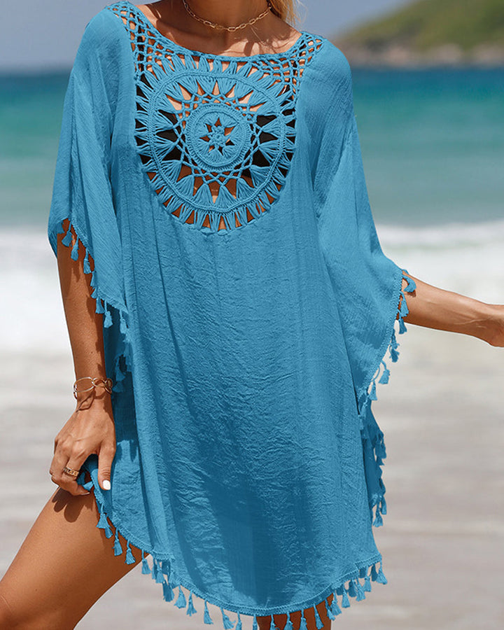 Flowy women's boho beach dress, ideal as a swim cover-up with crochet knit and unique tassel accents.