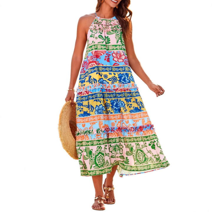 Women's chic boho halter tiered maxi dress. Flowy summer style with a vibrant floral print, perfect for beach or vacation.