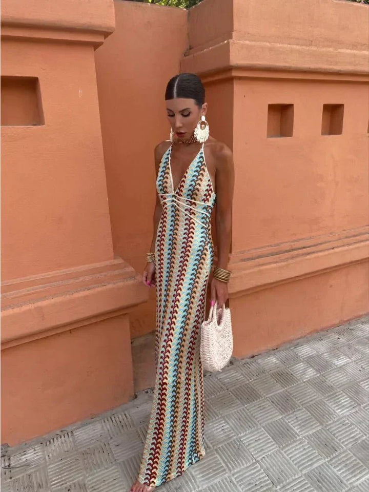 Boho chic printed maxi dress with halter neck, ideal for wedding guests & elegant parties.