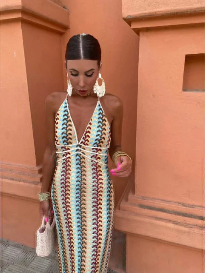 Chic bohemian V-neck maxi wedding guest dress, vibrant print, flowy and stylish.