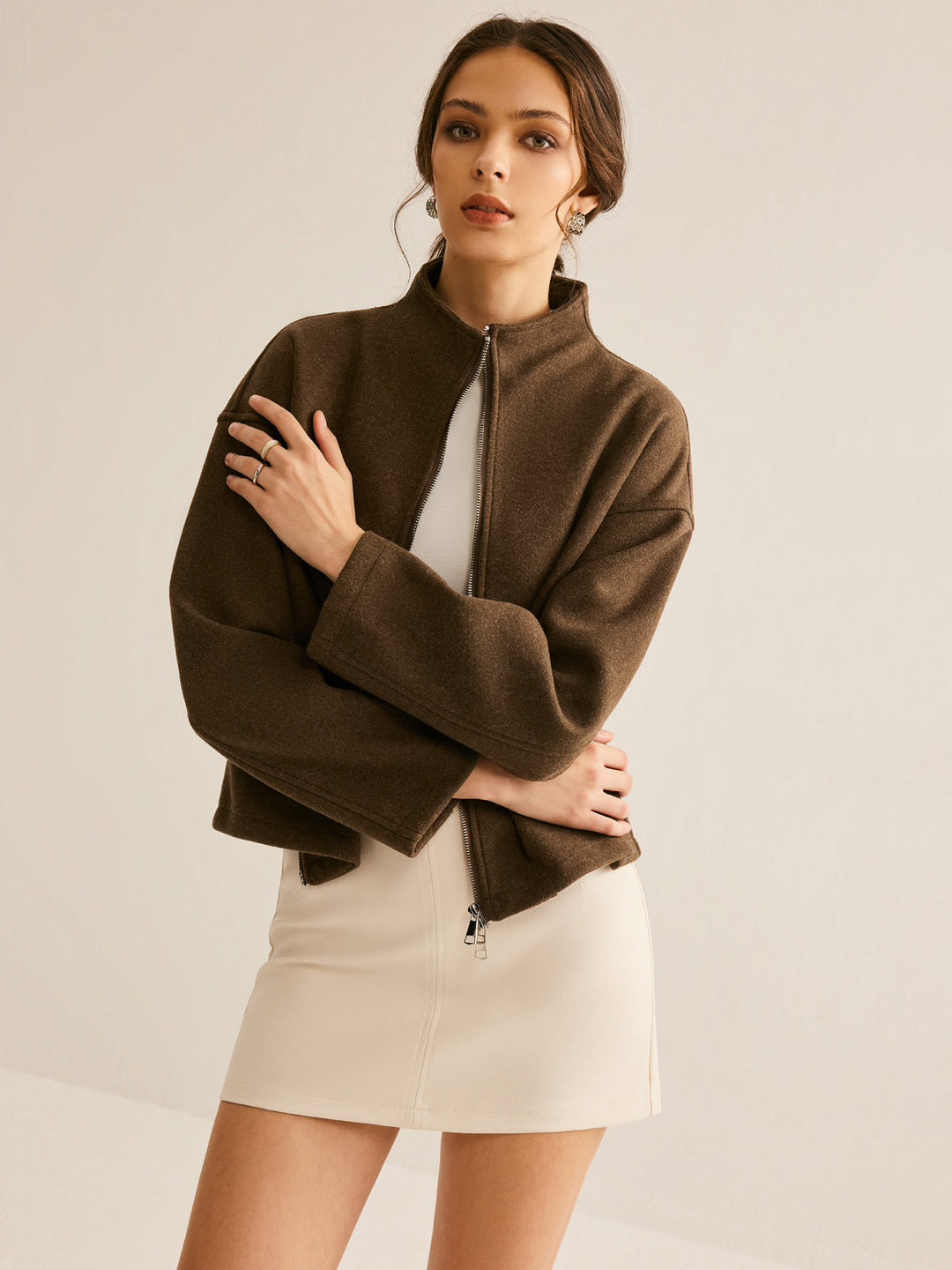 Chic women's brown jacket with zipper, a versatile fashion statement suitable for any occasion.