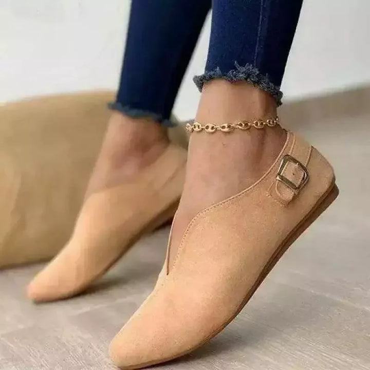 Women's stylish buckle loafers with a decorative strap, offering all-day comfort.