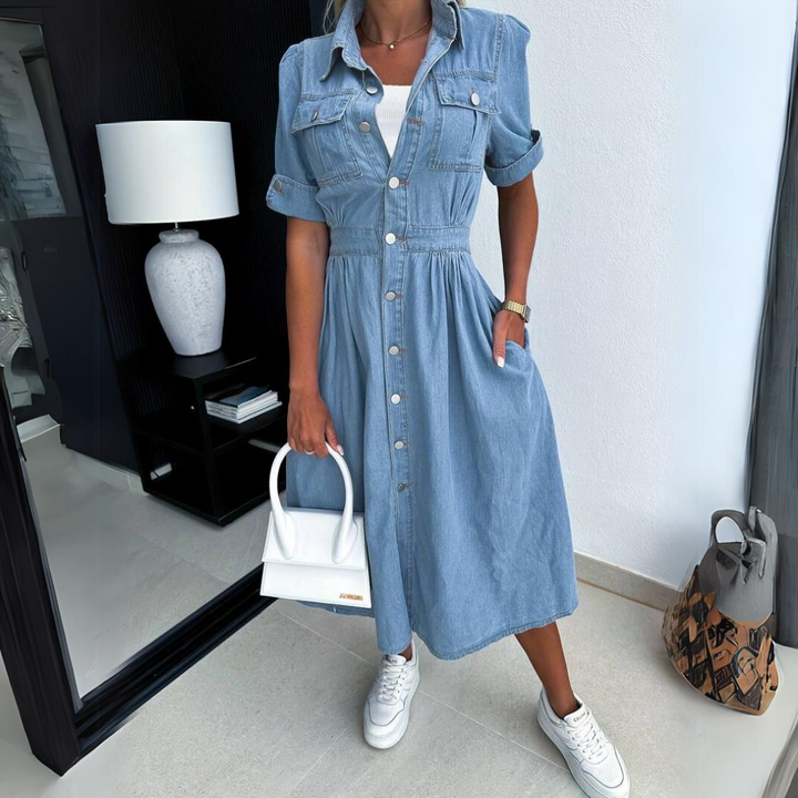Close-up of elegant women's button-up midi dress. Detail shows short sleeves & versatile fabric, ideal for daywear.