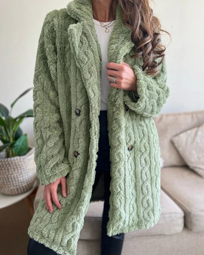 Stylish women's cable knit overcoat, perfect for cozy and elegant winter fashion.