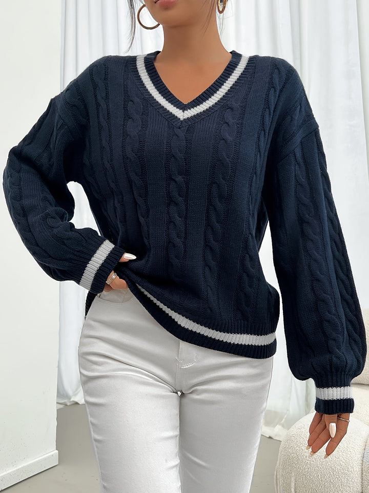 Versatile women's cable knit V-neck jumper, perfect for autumn styling, with elegant lantern sleeves.