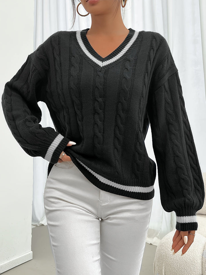Aurora women's chic cable knit V-neck sweater with sophisticated lantern sleeves. Elegant winter comfort.