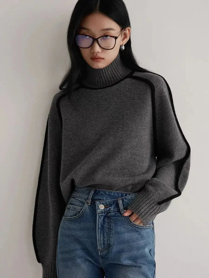 Elegant women's turtleneck sweater featuring unique contrast seams, a must-have for autumn and winter fashion.