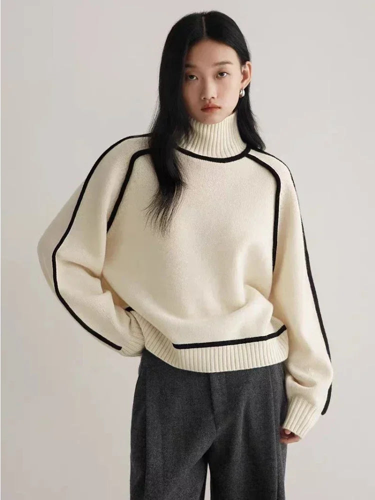 Fashionable women's turtleneck sweater with contrast seams, excellent for cozy autumn & winter layering.