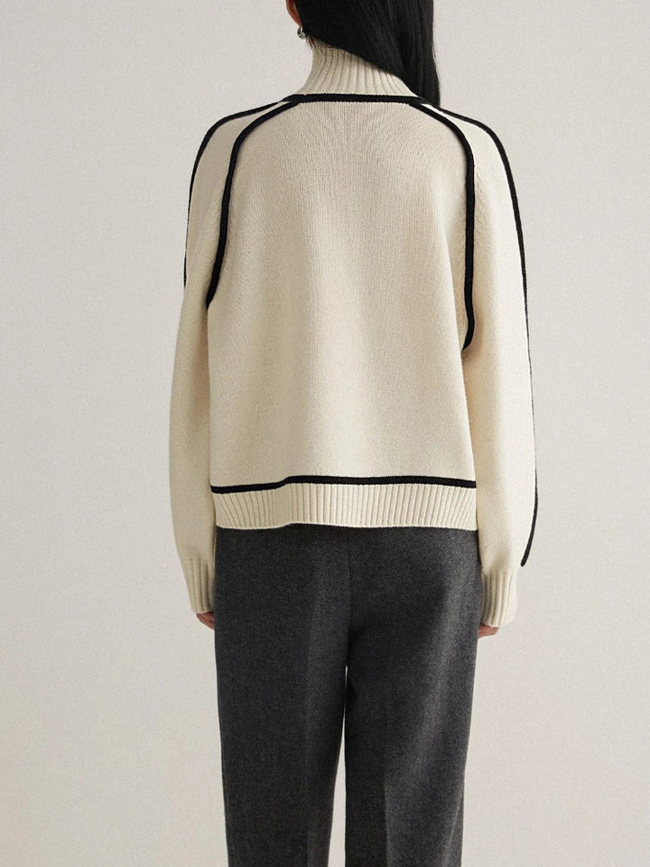 Stylish women's turtleneck with unique contrast seams, perfect for elegant office wear or sophisticated casual looks.