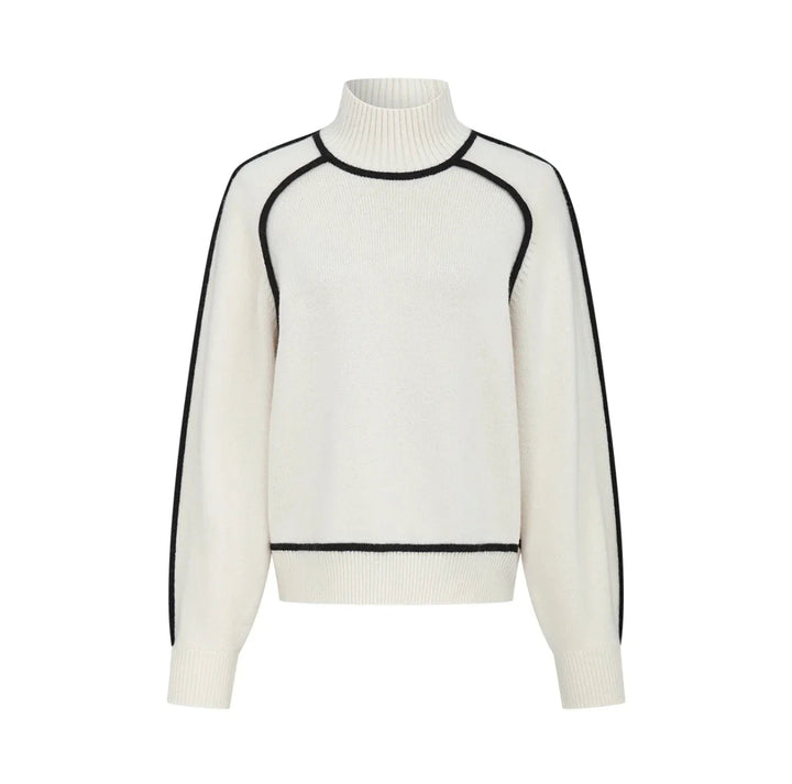 Chic women's contrast seam turtleneck sweater in a relaxed fit, essential for modern autumn and winter fashion.