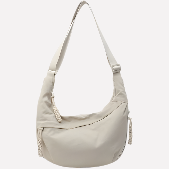 Women's chic crescent shoulder bag with braided detail, perfect for effortless everyday style.