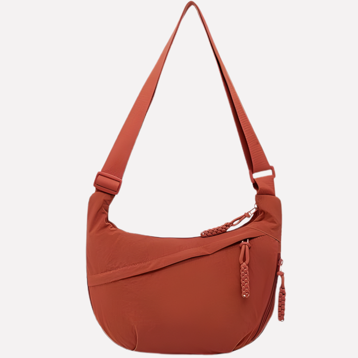 Effortless everyday style with this chic women's crescent shoulder bag, featuring unique braided details.