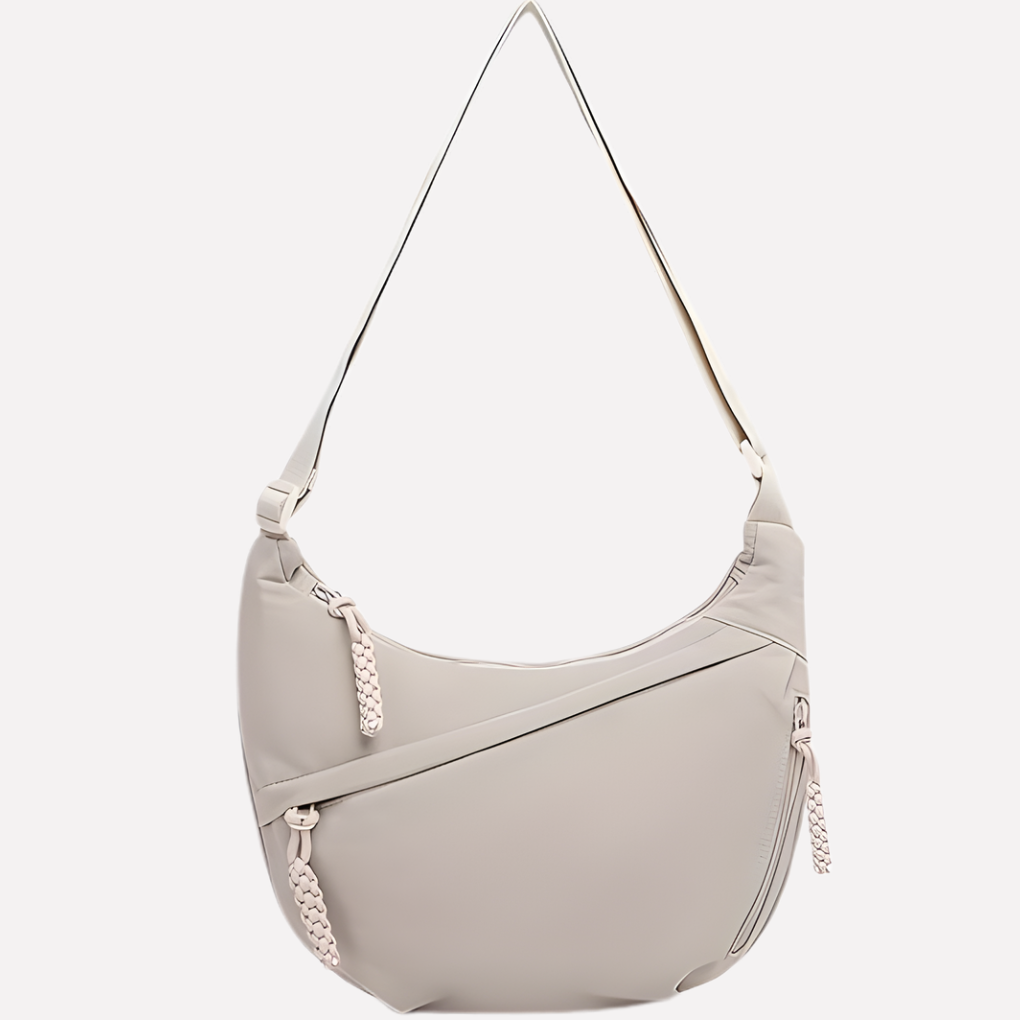 Versatile women's shoulder bag, a stylish crescent-shaped accessory for organized everyday elegance.