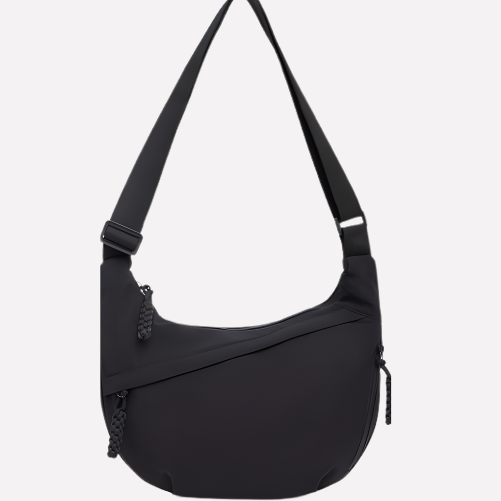 Chic women's everyday crescent bag, offering ample space and style with an adjustable shoulder strap.