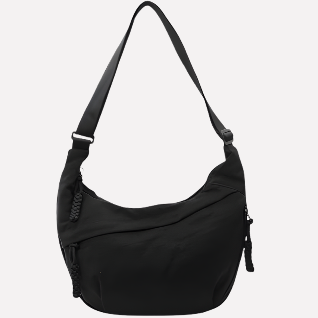 Trendy women's half-moon shoulder bag, designed with braided details for a modern, versatile look.