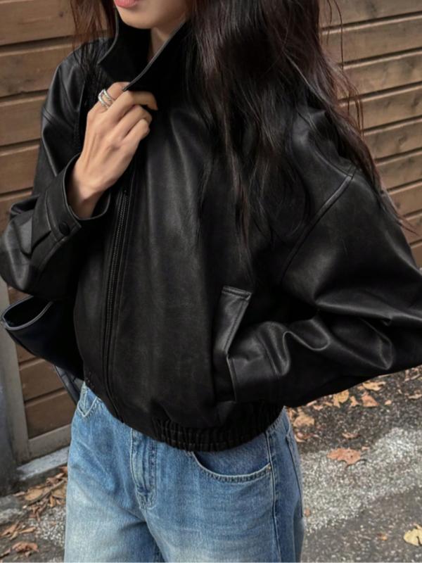 Statement women's cropped zip jacket with a stylish stand collar, offering a chic and modern look.