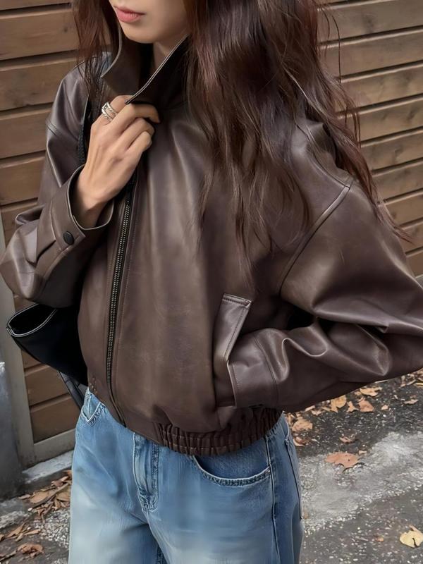 Women's fashionable cropped jacket with a sophisticated stand collar, versatile for spring and fall outerwear.